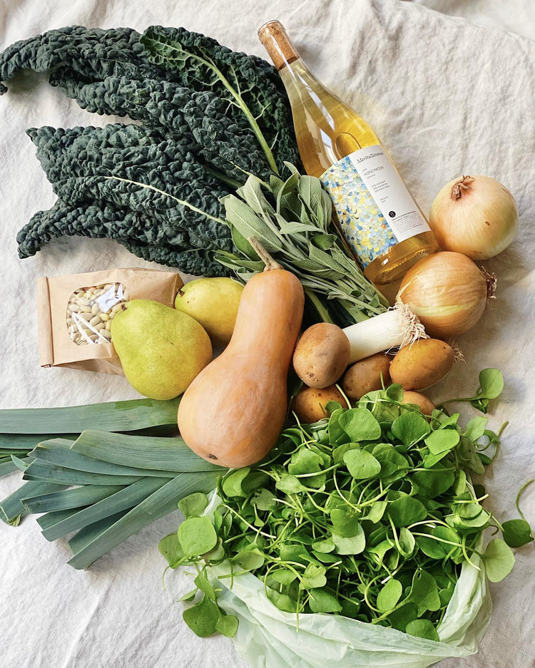 Martha Stoumen Honeymoon 2021 with a Farmers Market bounty of lacinto kale, microgreens, butternut squash, leeks, beans, and onions.